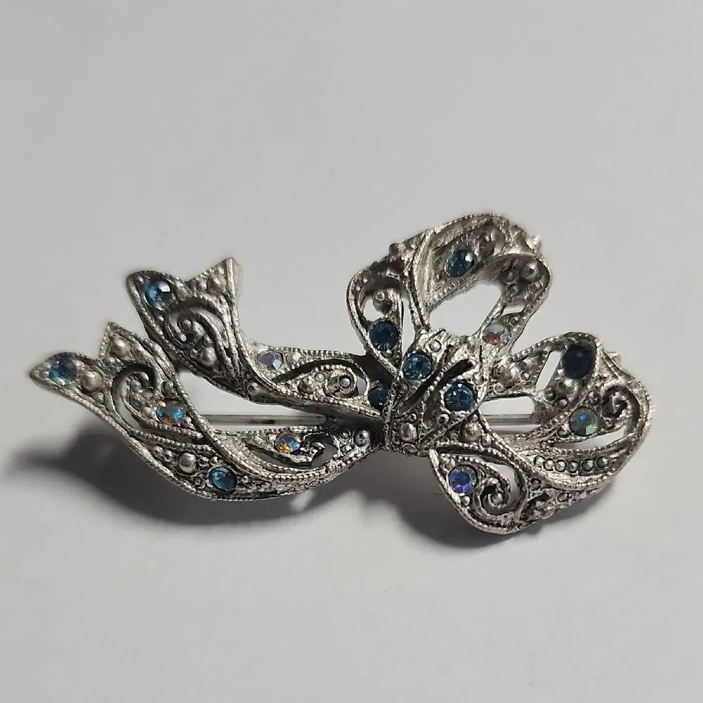 Elegant Silver Bow Brooch with Blue Accents